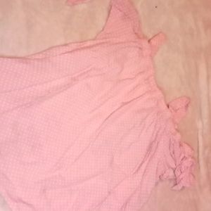 I am selling an off the shoulder pink with white dottes shirt